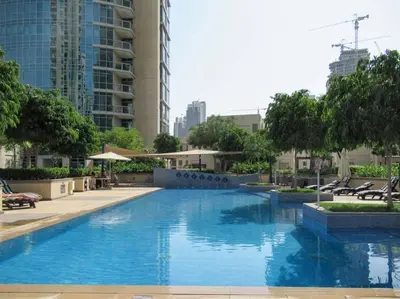 a large blue swimming pool in a city at Frank Porter - The Residences Tower 8 in Dubai