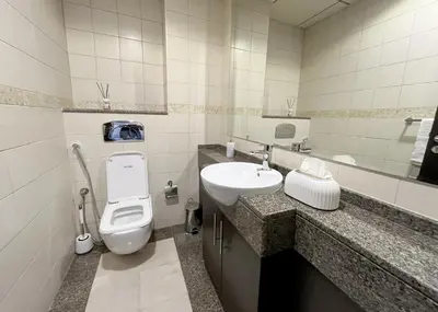 a bathroom with a toilet and a sink at Stunning 1 bedroom in JBR with Balcony - Dubai Marina Mall view in Dubai