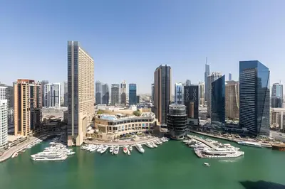 a view of a city with boats in the water at Stunning 1 bedroom in JBR with Balcony - Dubai Marina Mall view in Dubai