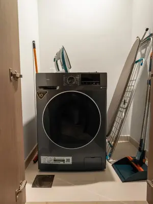 a microwave oven sitting on the floor in a room at Wabi-Sabi Style Fountain-View 4 BR Apt in the Sky in Dubai