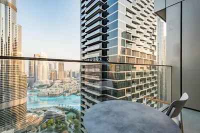 a room with a table and a view of a city at Elegant 3BR at The Address Residences Dubai Opera, Downtown Dubai by Deluxe Holiday Homes in Dubai