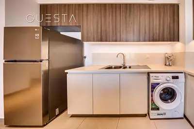a kitchen with a stainless steel refrigerator and a dishwasher at Park Heights 1 by Emaar, Dubai Hills Estate in Dubai