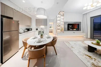 a kitchen and dining room with a table and chairs at Park Heights 1 by Emaar, Dubai Hills Estate in Dubai