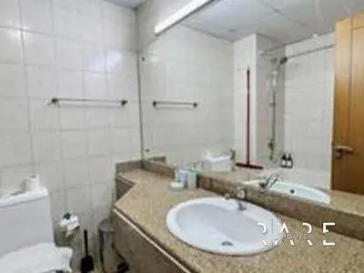 a bathroom with a sink and a mirror at Rare Holiday Homes - Near Metro - Garden View - Mogul Cluster - Building# 204 - RG09 - Discovery Gardens in Dubai