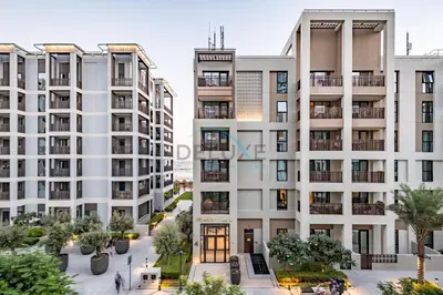 an aerial view of an apartment building at Bright 2BR in Surf at Creek Beach Building 1, Creek Harbour by Deluxe Holiday Homes in Dubai