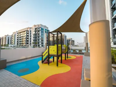 a playground on the roof of a building at EasyGo - Bright and Airy Studio in Azizi Riviera 9 in Dubai