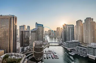 a view of a city with a river and buildings at Lovely Studio in The Address Residence Dubai Marina by Deluxe Holiday Homes in Dubai