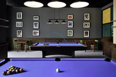 a billiard room with a purple pool table at Lovely Studio in The Address Residence Dubai Marina by Deluxe Holiday Homes in Dubai