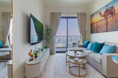 a living room with a couch and a table at Casa Azure in Dubai