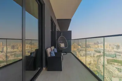 a room with a balcony with a view of the city at Casa Azure in Dubai