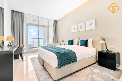 a bedroom with a large bed and a large window at Keysplease 1BR Apartment Damac Maison Prive Business Bay in Dubai