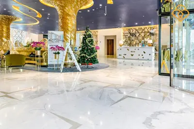 a lobby with a christmas tree in the middle at Keysplease 1BR Apartment Damac Maison Prive Business Bay in Dubai