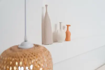 a group of vases sitting on a shelf at Apartment on Palm Jumeirah Beach Parking in Dubai