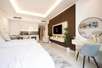 a bedroom with a large bed and a mirror at Outstanding New Studio With 2 Double Beds,In Downtown in Dubai