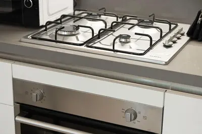 a stove top oven with two burners on it at Outstanding New Studio With 2 Double Beds,In Downtown in Dubai