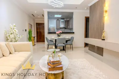 a living room with a couch and a table at Luxury 2 Apartments Dunya tower Burj Khalifa St in Dubai