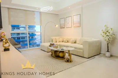 a living room with a couch and a table at Luxury 2 Apartments Dunya tower Burj Khalifa St in Dubai