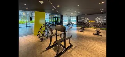 a gym with treadmills and exercise equipment in a building at Samani vacation homes 3018 in Dubai