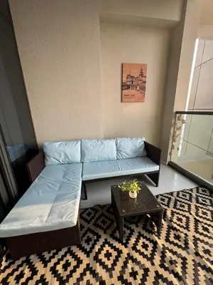 a living room with a couch and a table at Samani vacation homes 3018 in Dubai