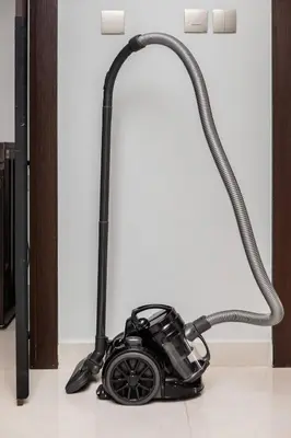 a vacuum on the floor with a hose at 10 Mins to Dubai Mall1BRBusiness Bay Heaven in Dubai
