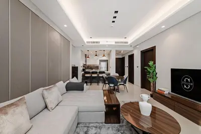 a living room with a couch and a table at 10 Mins to Dubai Mall1BRBusiness Bay Heaven in Dubai