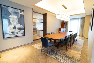 a dining room with a table and chairs at ADDRESS Residences Dubai Opera at Downtown in Dubai