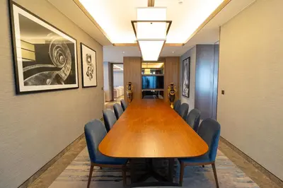 a conference room with a long table and chairs at ADDRESS Residences Dubai Opera at Downtown in Dubai