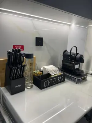 a kitchen counter with a coffee bar on it at The Burj and Canal Views in Dubai