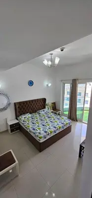 a bedroom with a large bed in a room at Bedroom with attach bath and balcony in Marina Dubai in Dubai
