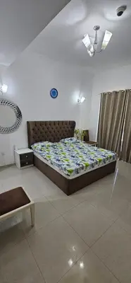 a bedroom with a large bed in a room at Bedroom with attach bath and balcony in Marina Dubai in Dubai