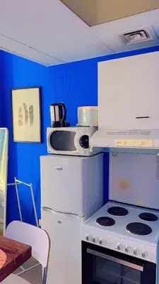 a kitchen with a white stove and a refrigerator at Aesthetic Blue Studio on Marina Walk in Dubai
