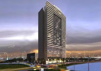 a tall building in a city next to a river at Bespoke Holiday Homes - High floor studio in Tower 108 JVC in Dubai