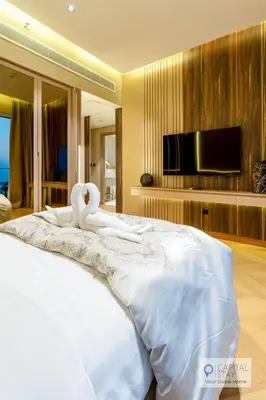 a bedroom with a large bed with swans on it at Luxury Beachfront 3 Bed Apt in Dubai JBR in Dubai