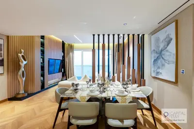 a dining room with a table and chairs at Luxury Beachfront 3 Bed Apt in Dubai JBR in Dubai