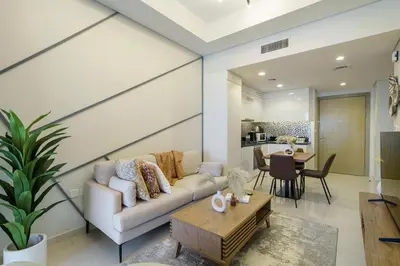 a living room with a couch and a table at Higher Floor 2BR in Aykon City Discounted Prices in Dubai