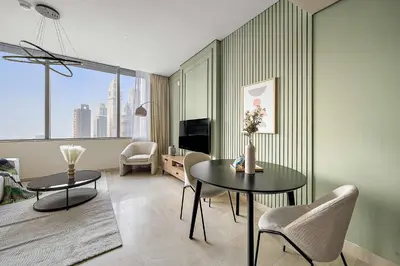 a living room with a table and chairs at Silkhaus Sky Gardens at Homestyle Studio in DIFC in Dubai