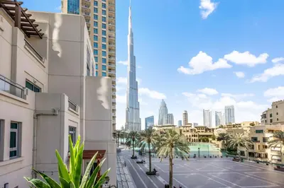 a view of a city with a parking lot at Durrani Homes - Azure 2BR with Burj Khalifa and Fountain View in Dubai