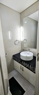 a bathroom with a sink and a mirror at Superb 1 BR apt next to Burj Khalifa and Dubai mall in Dubai