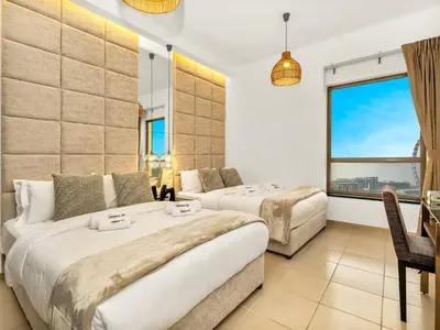 a hotel room with two beds and a window at WonderfulStay At JBR - Luxury Dubai Eye View Living - Beach Access - Brand New Luxury Apartments in Dubai
