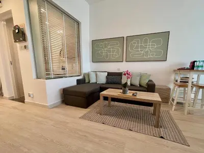 a living room with a couch and a coffee table at Boutique Studio in Palm Jumeirah - Stunning View in Dubai