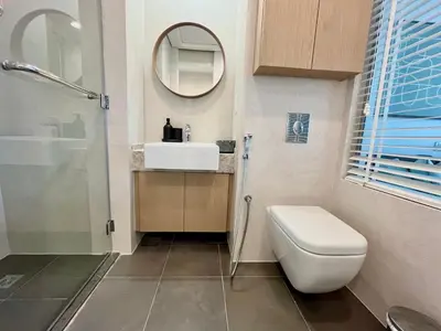 a bathroom with a toilet and a sink and a mirror at Boutique Studio in Palm Jumeirah - Stunning View in Dubai