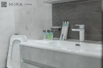 a bathroom sink with toothbrushes on top of it at Mira Holiday Homes - Cosy 1 bedroom close to metro Al Furjan in Dubai