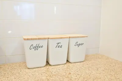 two trash cans sitting on a counter in a bathroom at Burj Vista 2BR Luxurious Apartment with Direct Access to Dubai Mall in Dubai