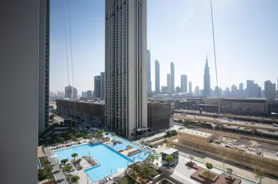 an aerial view of a city with a swimming pool at Apartment in Downtown Dubai in Dubai