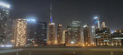a city skyline at night with lit up buildings at Sky villa 103 in Dubai