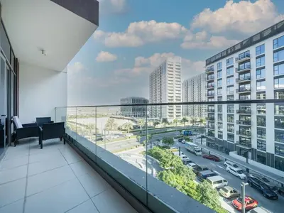 a balcony with a view of a city at Tranquil 1 Bedroom Dubai Hills Escape in Dubai