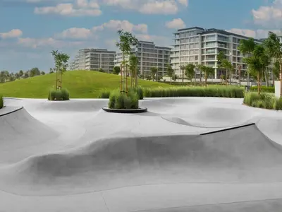 a skate park with a skateboard ramp in front of a building at Tranquil 1 Bedroom Dubai Hills Escape in Dubai