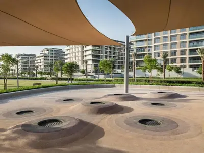 a view of a building with a large umbrella at Tranquil 1 Bedroom Dubai Hills Escape in Dubai
