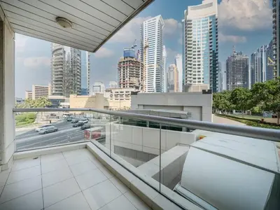 a view of a city from the balcony of a building at Bright 1-Bedroom with Marina Infinity Pool in Dubai