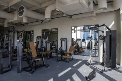 a gym with a lot of treadmills and machines at Modern Studio, Burj Views - Business Travelers in Dubai